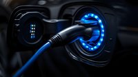 Electric vehicle charging port glowing with bright blue light while plugged in, close-up view showing modern automotive technology and clean energy concept.