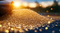 Glowing water droplets on surface at golden sunset with bokeh light effects and shallow depth of field creating dreamy atmosphere.