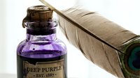 Deep purple ink in vintage glass bottle with cork stopper and feather quill for calligraphy, writing, and artistic projects.