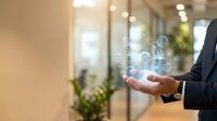 Businessman in suit holding glowing digital network hologram in modern office, showcasing innovation, connectivity, and future technology concepts.