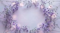 Delicate purple dried flowers arranged in circular frame with soft fairy lights creating romantic floral border on light background for wedding invitations.