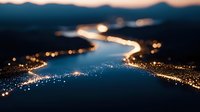 Aerial view of glowing river winding through dark landscape at night, golden bokeh lights reflecting on water surface.