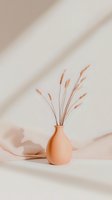 Dried wheat stalks in terracotta vase against neutral beige wall with soft shadows. Minimalist composition with natural light creates calm, modern aesthetic.
