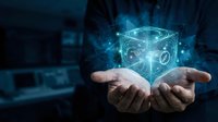 Hands holding glowing digital cube with holographic symbols and light effects in dark tech environment for innovation and technology concepts.