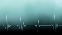 Medical heartbeat rhythm line on gradient teal background showing cardiac pulse waves for healthcare and wellness concepts.