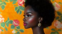 Young African woman with natural afro hairstyle and red lipstick in profile against orange floral background. Gold earring and glowing makeup highlight elegant beauty.