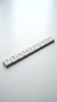 White letter tiles spelling FRAMEWORK arranged in row on clean white background for business and organizational concepts.