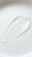 White cream or lotion smear on neutral background, isolated for skincare, cosmetics, and beauty product design applications.