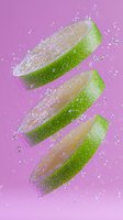 Fresh lime slices floating with water drops against pink background, dynamic composition with splashing droplets creates refreshing summer drink concept.