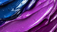 Abstract fluid art background with vibrant blue and purple paint swirls creating dynamic flowing pattern, macro photography showing rich texture and glossy surface.