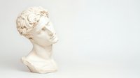 Classical white marble bust sculpture with curly hair against light background, profile view showcasing detailed Hellenistic style craftsmanship and artistic expression.