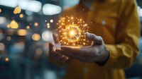 Woman holding glowing sparkler creating magical light effect with bokeh background in warm golden tones, concept of hope, celebration and wonder.