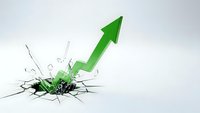 Green arrow breaking through cracked surface symbolizing breakthrough, growth, success and overcoming obstacles in business and personal development.