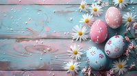 Decorated Easter eggs in pastel pink and blue tones with white daisies and cherry blossoms on rustic wooden background. Spring holiday celebration composition.
