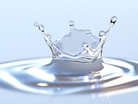Crown-shaped water splash with droplets frozen in time against light background, capturing liquid dynamics and surface tension in high-speed macro photography.