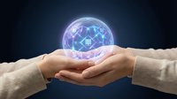 Hands holding glowing digital brain with neural network connections representing artificial intelligence, machine learning and futuristic technology concepts.