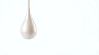 Isolated pearl or milk drop suspended against white background, ready for design projects, cosmetics packaging, skincare branding, and product mockups.
