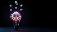 Glowing light bulb with brain inside surrounded by floating renewable energy icons on dark background for innovation and sustainability concepts.