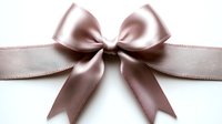 Elegant satin bow in dusty rose pink color with symmetrical loops and tails on white isolated background, suitable for gift wrapping and decoration.