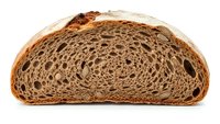 Artisan sourdough bread slice showing intricate swirled pattern and airy texture with golden crust on white background isolated for bakery designs.