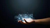 Hand holding glowing digital security icons with lock symbols and network connections representing cybersecurity and data protection technology.