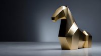 Elegant gold geometric horse sculpture with angular facets on minimalist gray surface against dark background.