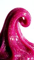 Vibrant magenta glitter slime with sparkles flowing in elegant spiral shape against white background, isolated for design use.