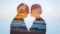 Romantic double exposure silhouette of senior couple merged with ocean sunset scene, waves crashing on beach during golden hour, showing eternal love and connection with nature.