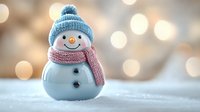 Cute snowman with blue knit hat and red scarf on snowy surface with warm bokeh lights background for holiday decorations and winter celebrations.
