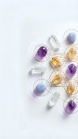 Colorful healing crystals and clear quartz connected by golden geometric network lines on white background for spiritual wellness and energy work.