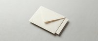 Elegant cream envelope on neutral background for wedding invitations, business correspondence, and stationery design projects.