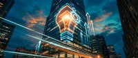 Modern skyscraper with illuminated glass facade at dusk, surrounded by city lights and dramatic sky. Corporate architecture and urban development concept for business, technology, and finance.