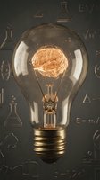 Light bulb with glowing brain filament against chalkboard with scientific formulas representing innovation, creativity, intelligence and breakthrough ideas.