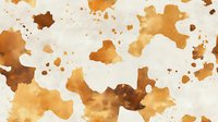 Abstract watercolor splashes and stains in warm brown and orange tones creating artistic texture for creative projects and backgrounds.