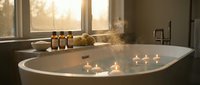 Luxurious spa bathroom with freestanding bathtub, floating candles, and amber bottles creating serene wellness atmosphere for relaxation and self-care rituals.