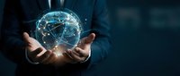Businessman holding glowing digital globe with network connections in hands representing global technology and worldwide communication solutions.