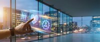 Businessman hand touching digital hologram display with network icons and data analytics interface in modern office with city skyline view.