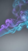 Colorful smoke swirls in purple and cyan hues creating elegant flowing patterns against gray background for modern design projects.