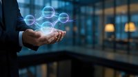 Businessman holding holographic business strategy icons with process, growth, and success concepts floating above palm in modern office environment.