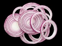 Red onion slices and rings isolated on transparent background, cut out and ready for food design, stickers, print on demand, sublimation, and T-shirt use.