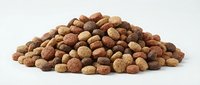 Mixed nuts pile with almonds, walnuts, hazelnuts and pecans on white background. Healthy snack food ingredients for cooking and baking recipes.