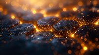 Abstract golden bokeh lights on dark blue textured surface creating magical glowing atmosphere with sparkling particles.
