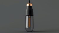 Modern black pendant light with copper accents and vintage Edison bulb on gray background for contemporary interior design and home decor projects.