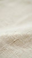 Footprints in sand leading into misty distance creating peaceful minimalist beach scene with soft neutral tones and dreamy atmospheric mood.