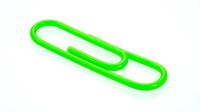 Green paper clip isolated on white background, a bright office supply symbol of organization and document management.