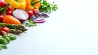Fresh colorful vegetables and herbs arranged on white background with copy space for healthy cooking and nutrition concepts.