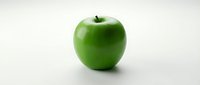 Fresh green apple isolated on white background, suitable for healthy eating, nutrition, and food design projects.