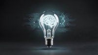 Glowing light bulb with brain circuit pattern inside on dark tech background representing artificial intelligence and innovation concepts.