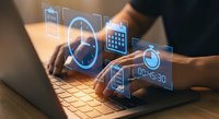 Business professional using laptop with holographic digital interface icons displaying data analytics and technology solutions for modern workplace productivity.