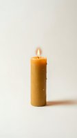 Single burning beeswax candle with bright flame on neutral background for meditation, relaxation and home decor concepts.